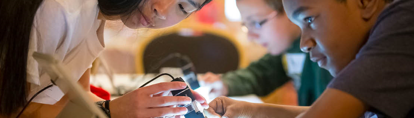 Two youth engaged in STEM activity