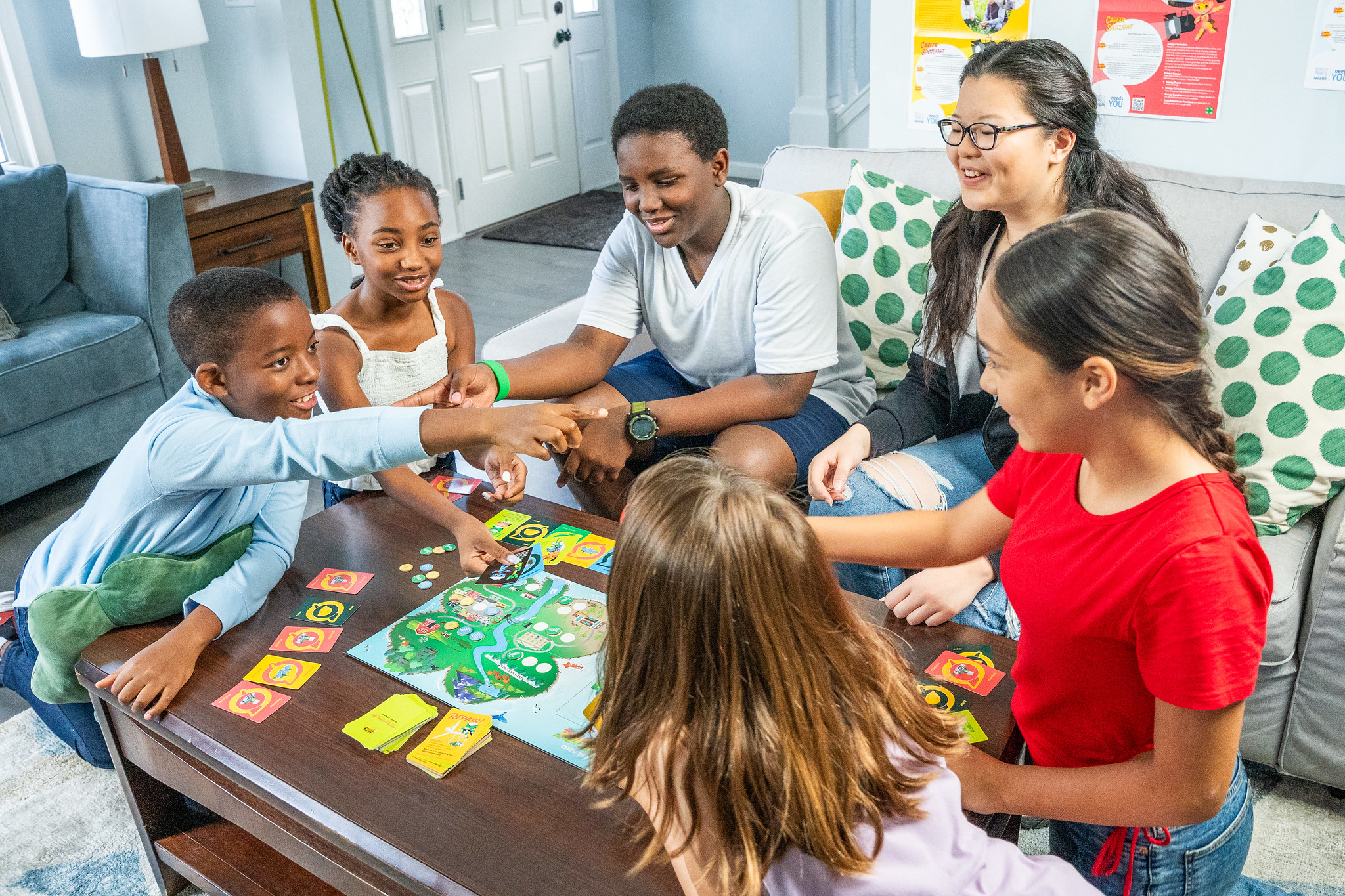 Group of young people playing a board game