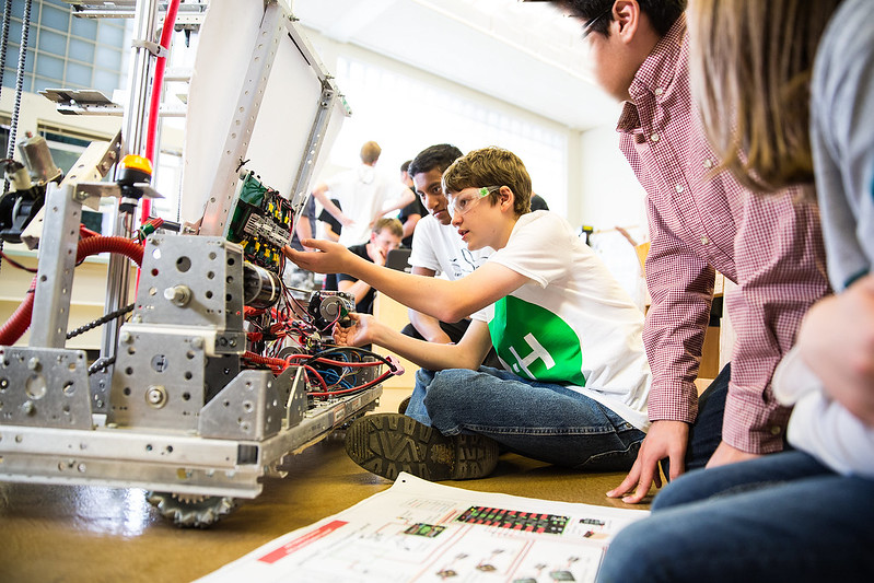 Youth participating in a robotics activity.