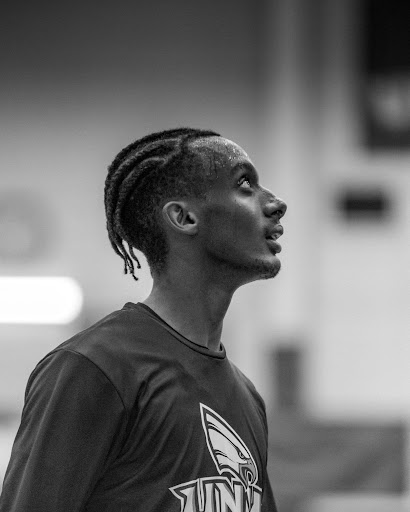 Black and white photo of a sweaty basketball player after playing a game.