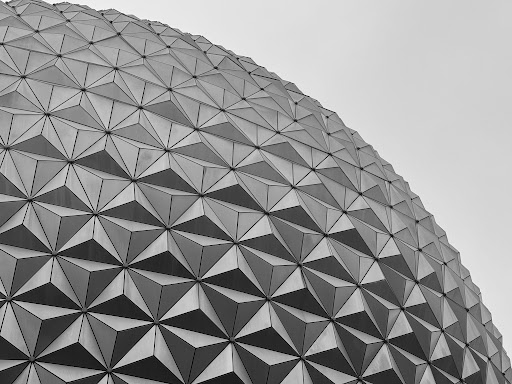 Black and white photo of Epcot at Disney World seen at an upward angle.