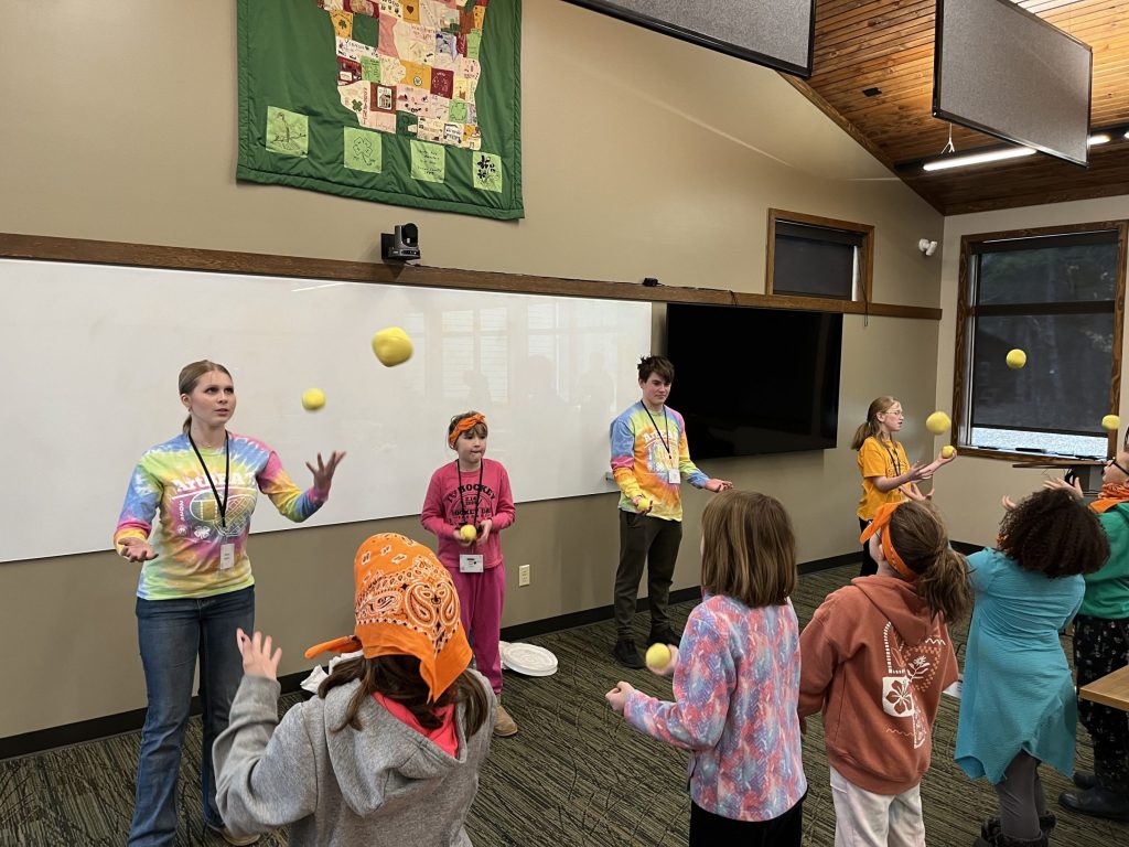 Youth learning to juggle at ArtBEAT!