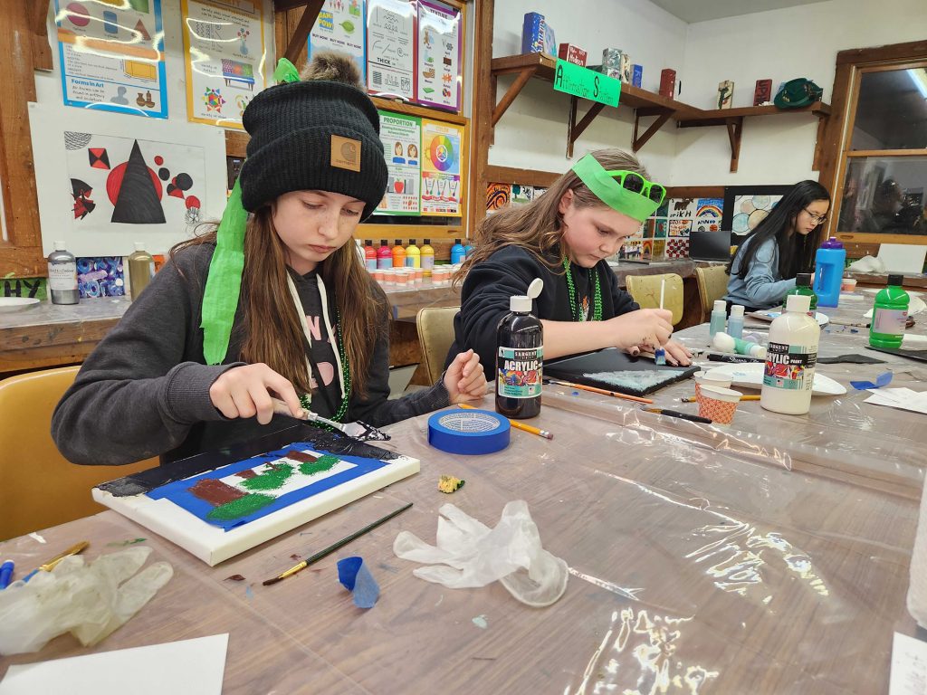 Youth painting at Arts Camp