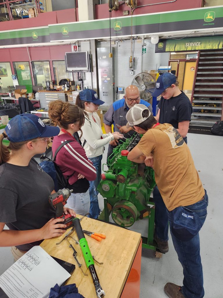 Youth participating in the automotive track at Summer Academy.