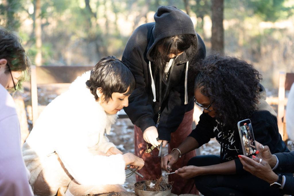 Older youth participating in a teambuilding activity.