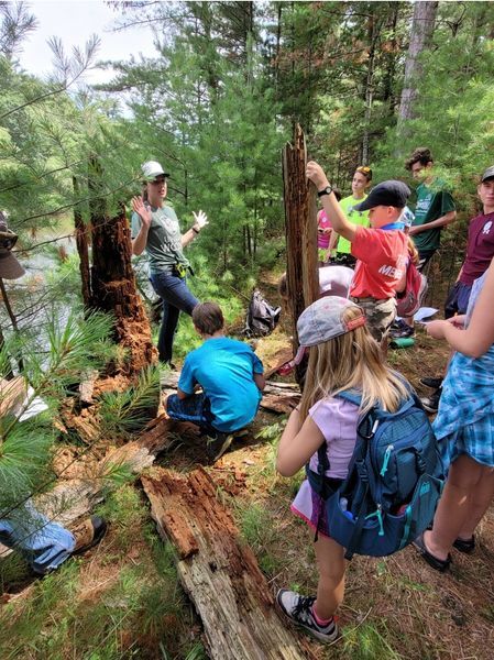volunteer teaching lesson at summer camp
