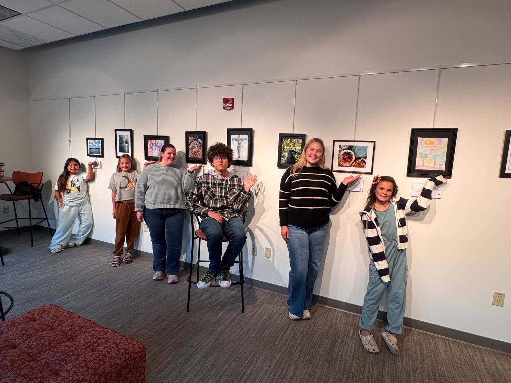 Youth artists from Marathon County standing with their creations.